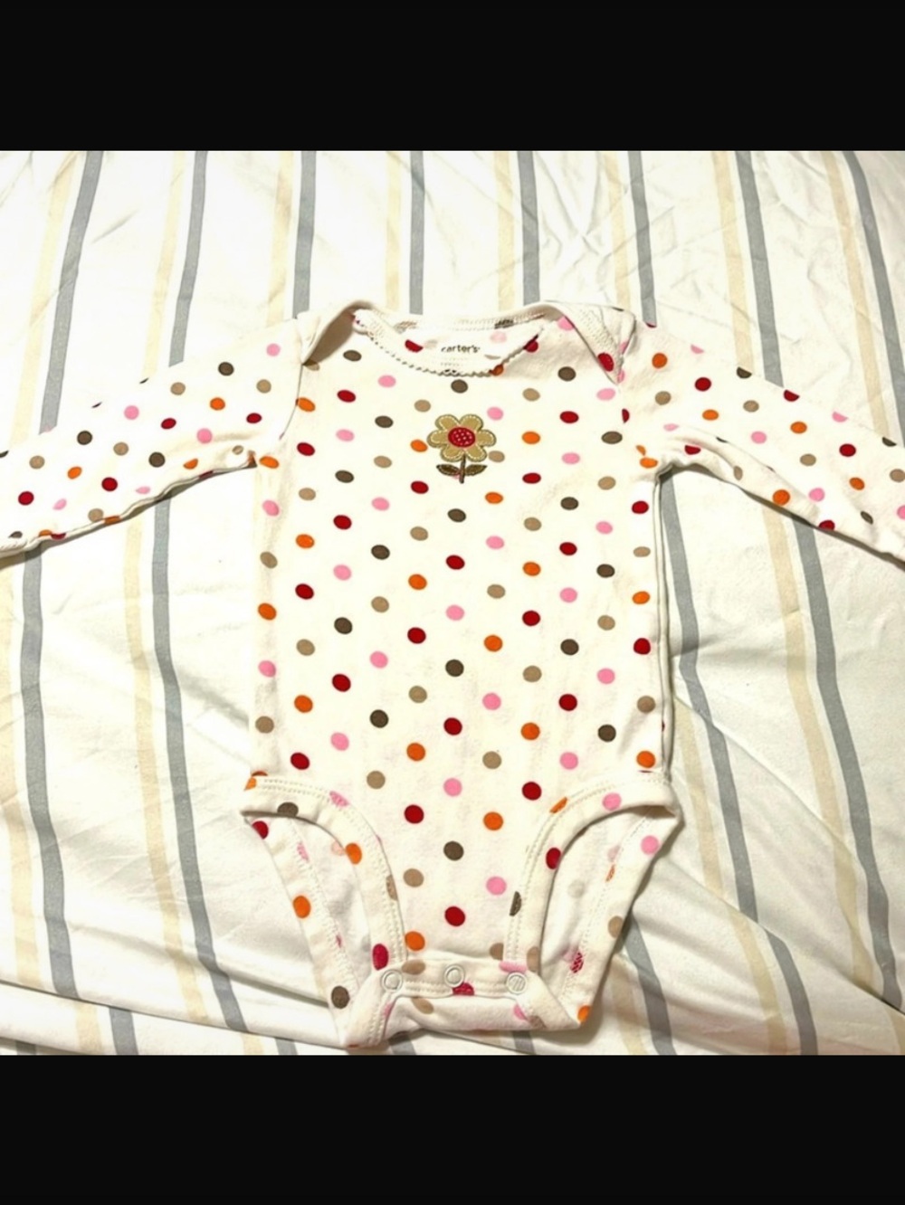 Carter's Polka-Dot long sleeved onesie with flower on chest, snaps